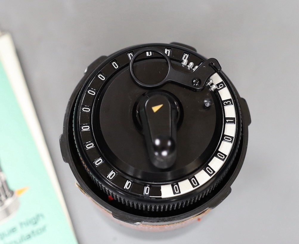 A Curta patent calculator serial number 535523, cased with original paperwork, case 12cms high